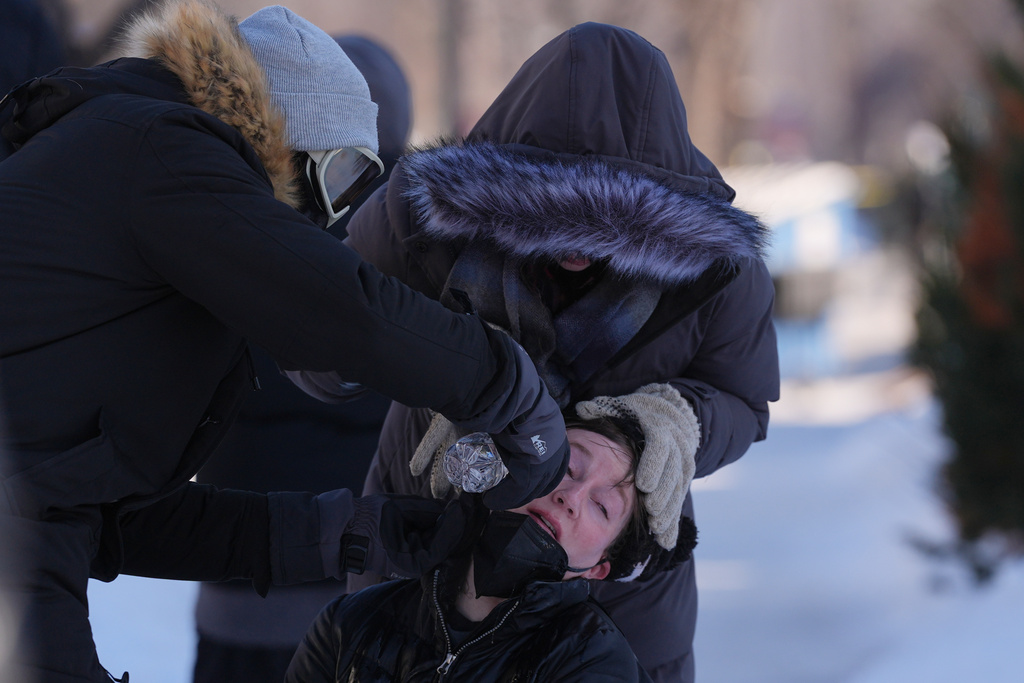 A person gets their eyes washed out after federal immigration officers deploy pepper spray Saturday, Jan. 24, 2026, in Minneapolis. (AP Photo/Abbie Parr)