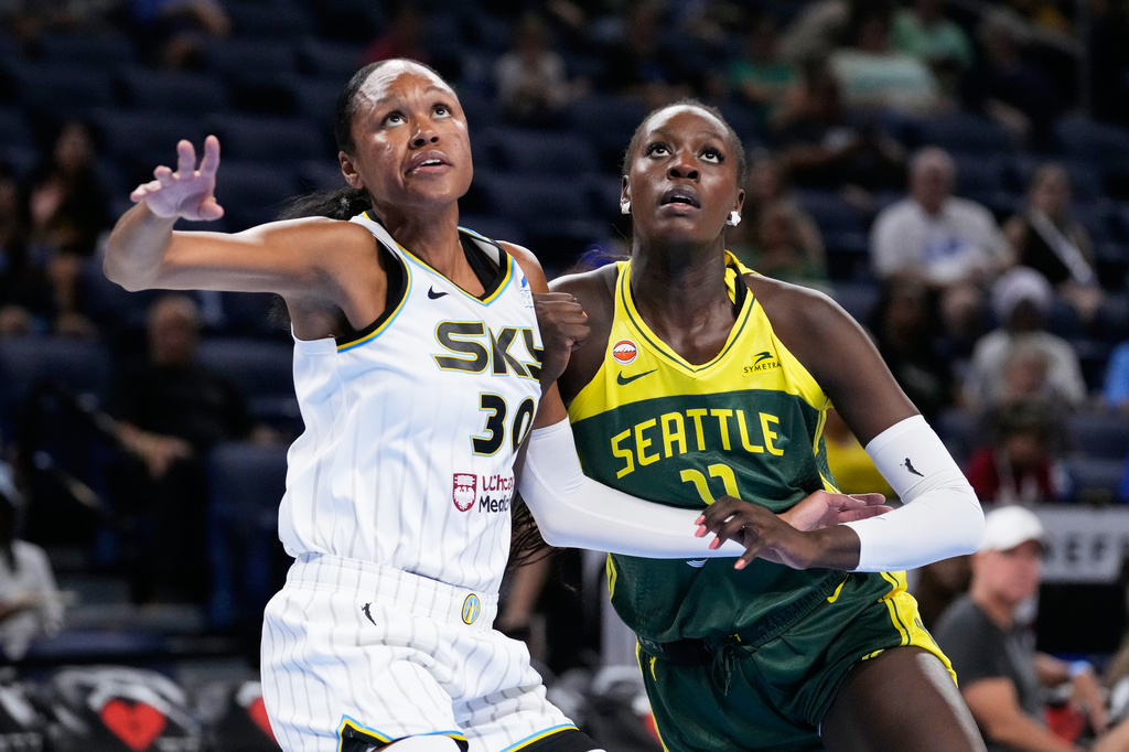 Chicago Sky forward-center Azura Stevens, left, and Seattle Storm center Awa Fam battle for a rebound during the first half of a WNBA basketball game Wednesday, July 15, 2026, in Chicago. (AP Photo/Nam Y. Huh)