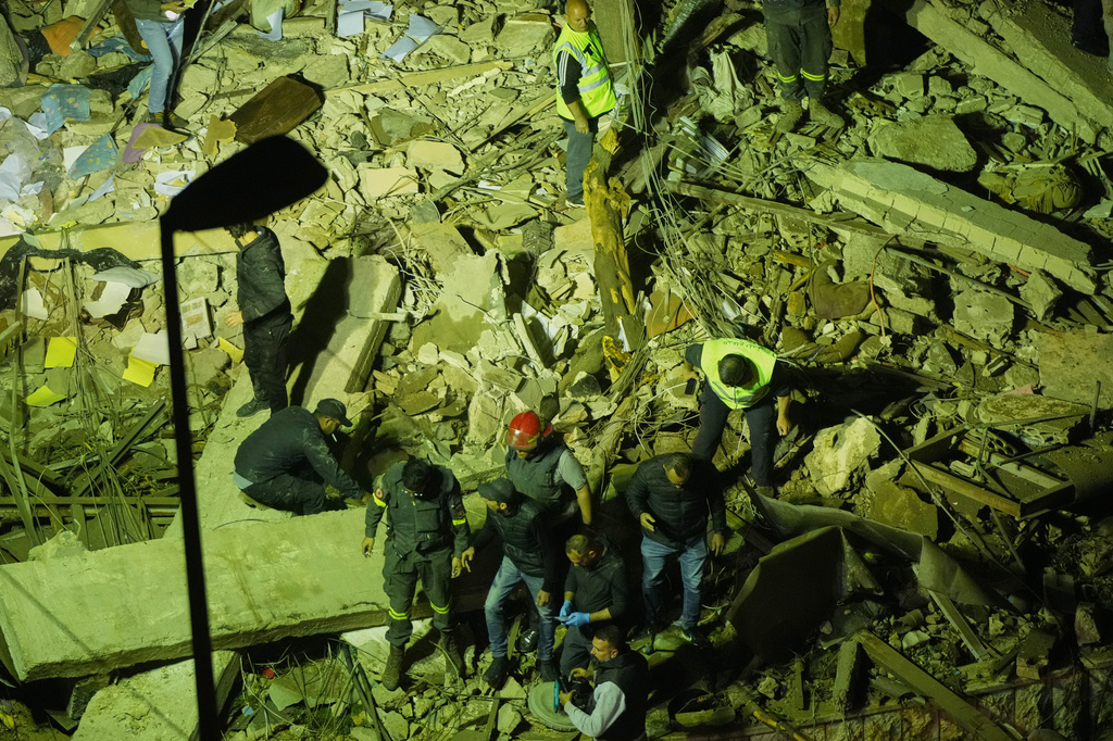 Rescue workers search through the rubble of a damaged building for survivors following an Israeli airstrike in Dahiyeh, Beirut's southern suburbs, Lebanon, Wednesday, May 6, 2026. (AP Photo/Hassan Ammar)