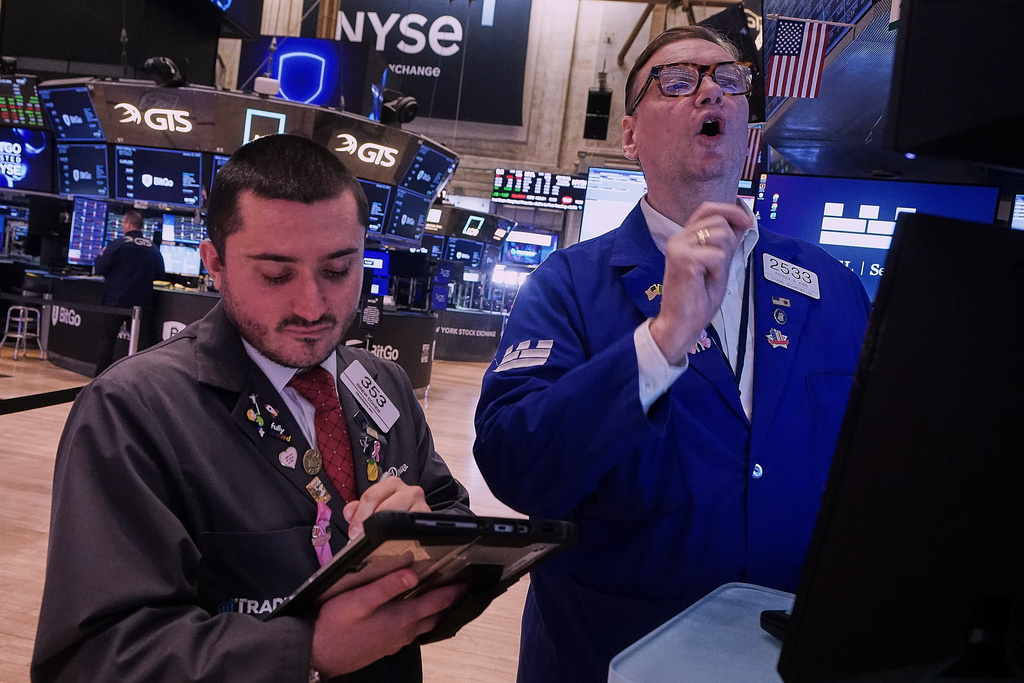 Trader Drew Cohen,; left, and Specialist Patrick King work on the floor of the New York Stock Exchange, Thursday, Jan. 22, 2026. (AP Photo/Richard Drew)