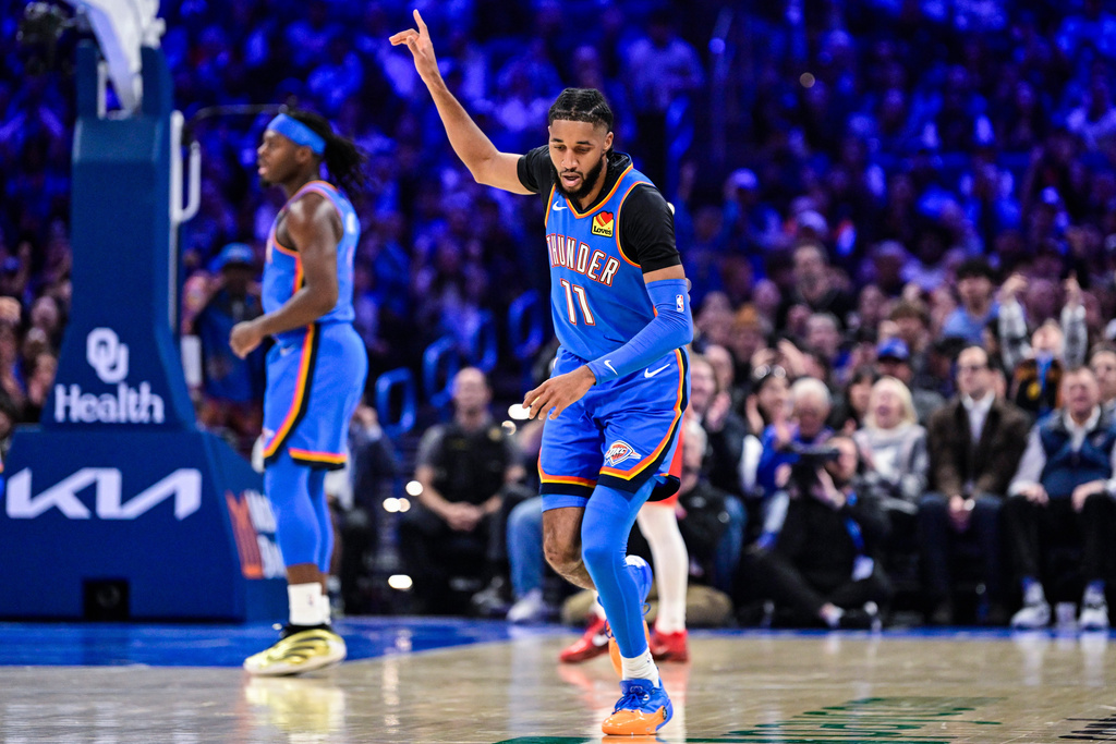 Oklahoma City Thunder guard Isaiah Joe (11) gestures against the New Orleans Pelicans during the first half of an NBA basketball game Tuesday, Jan. 27, 2026, in Oklahoma City. (AP Photo/Gerald Leong)