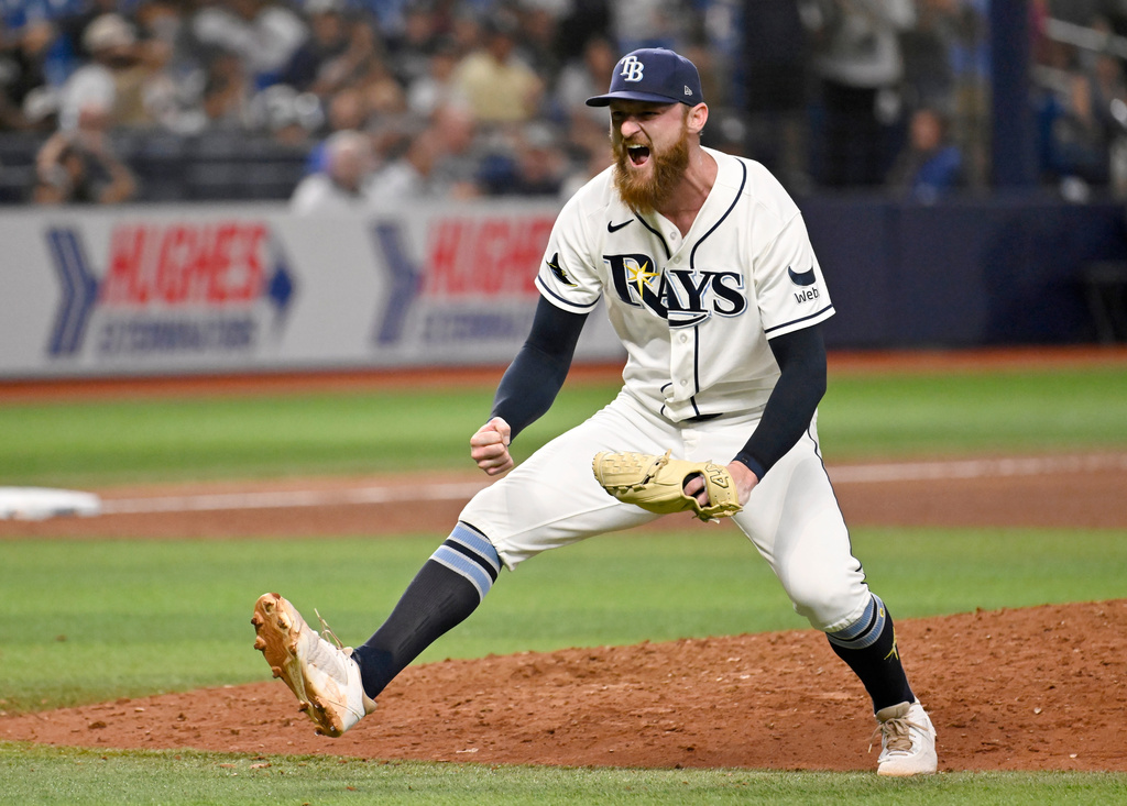 Tampa Bay Rays pitcher Bryan Baker celebrates after striking out New York Yankees' Trent Grisham for the final out in a baseball game Tuesday, July 7, 2026, in St. Petersburg, Fla. (AP Photo/Jason Behnken)
