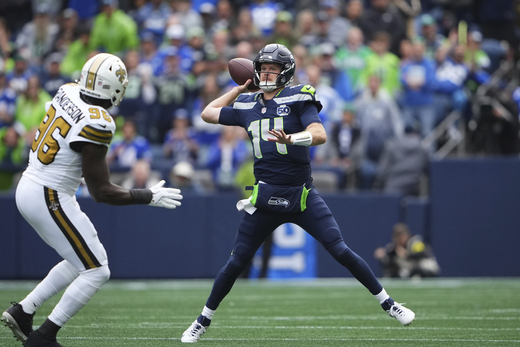 Seattle Seahawks quarterback Sam Darnold (14) passes during the first half of an NFL football game against the New Orleans Saints, Sunday, Sept. 21, 2025, in Seattle. (AP Photo/Stephen Brashear)
