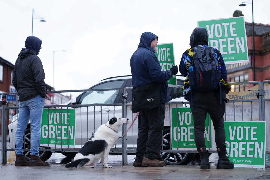 Green Party supporters in Levenshulme in northwest England, Thursday Feb. 26, 2026, as voters head to the polls in the Gorton and Denton constituency. (AP Photo/Jon Super)