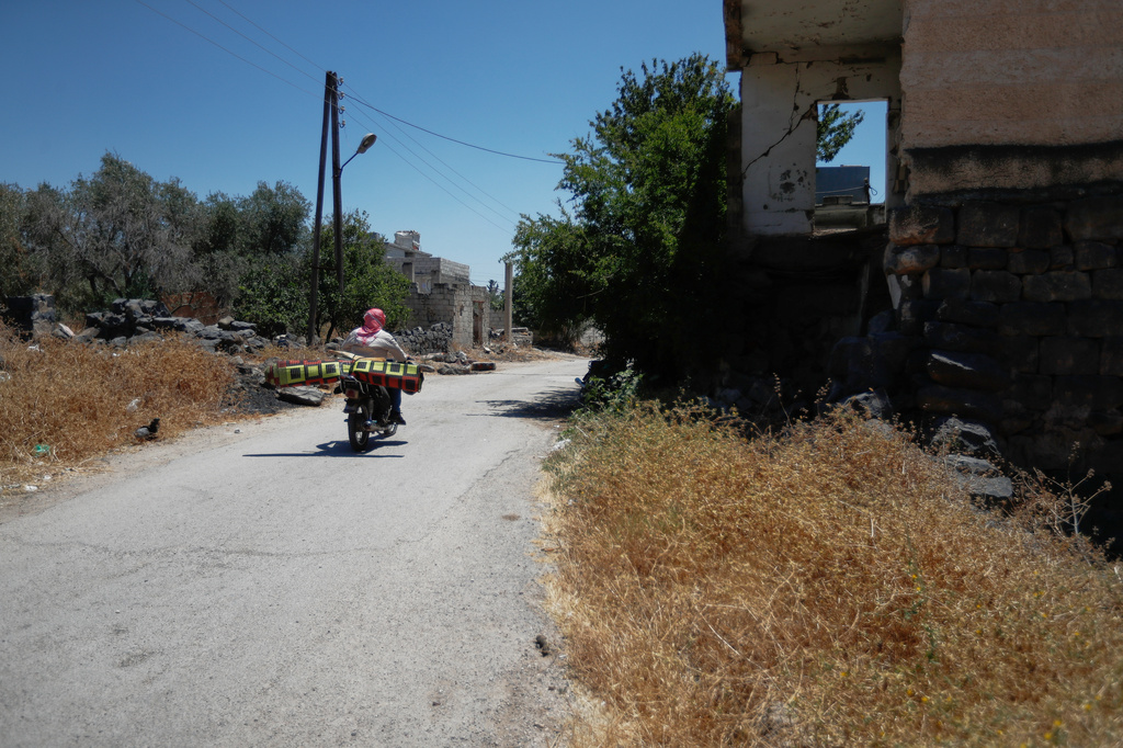 A man rides a motorcycle in the village of Abdin, Daraa province, Syria, Monday, June 29, 2026. (AP Photo/Omar Sanadiki)