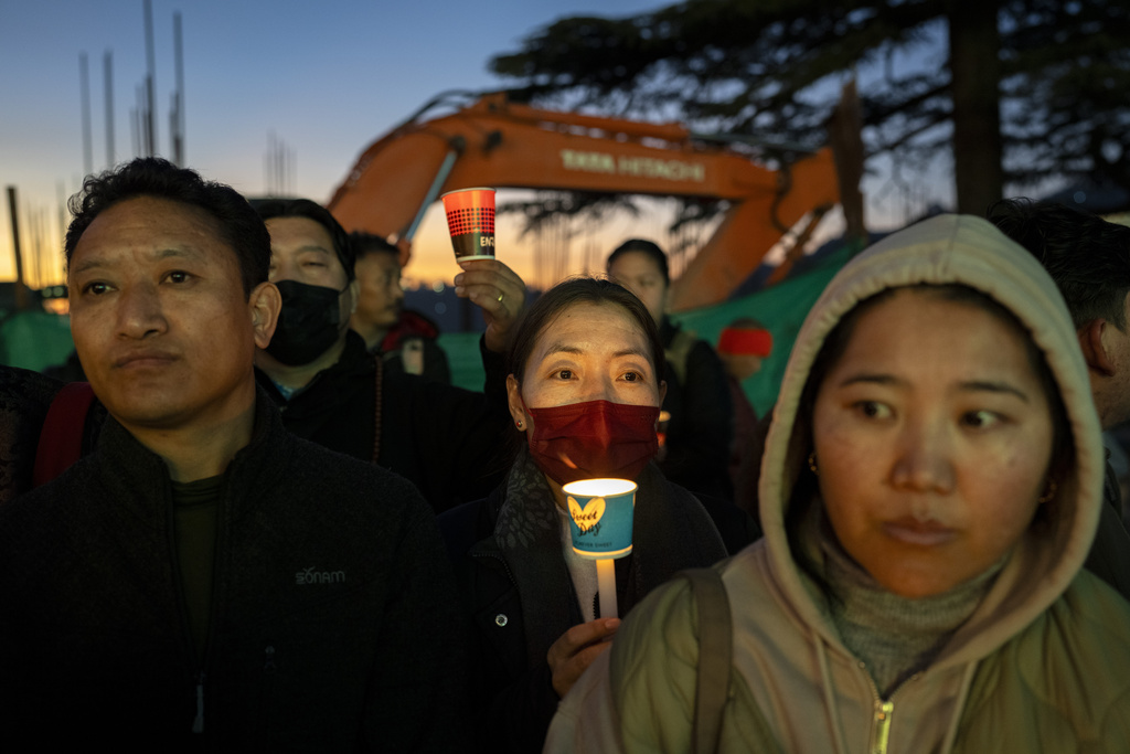 Exiled Tibetans participate in a candlelit vigil in Dharamshala, India, Wednesday, Jan. 8, 2025, in solidarity with the victims of an earthquake that hit a high-altitude Tibet region in western China on Tuesday. (AP Photo/Ashwini Bhatia)