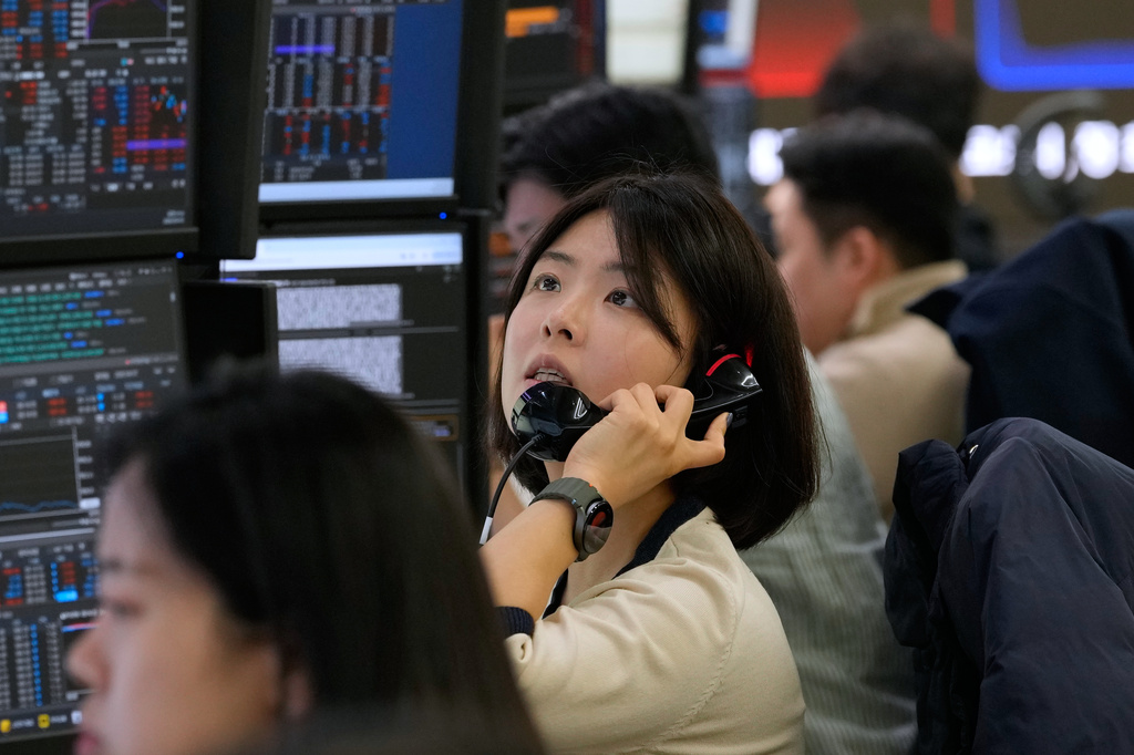 A currency trader talks on the phone at the foreign exchange dealing room of the Hana Bank headquarters in Seoul, South Korea, Friday, April 3, 2026. (AP Photo/Ahn Young-joon)