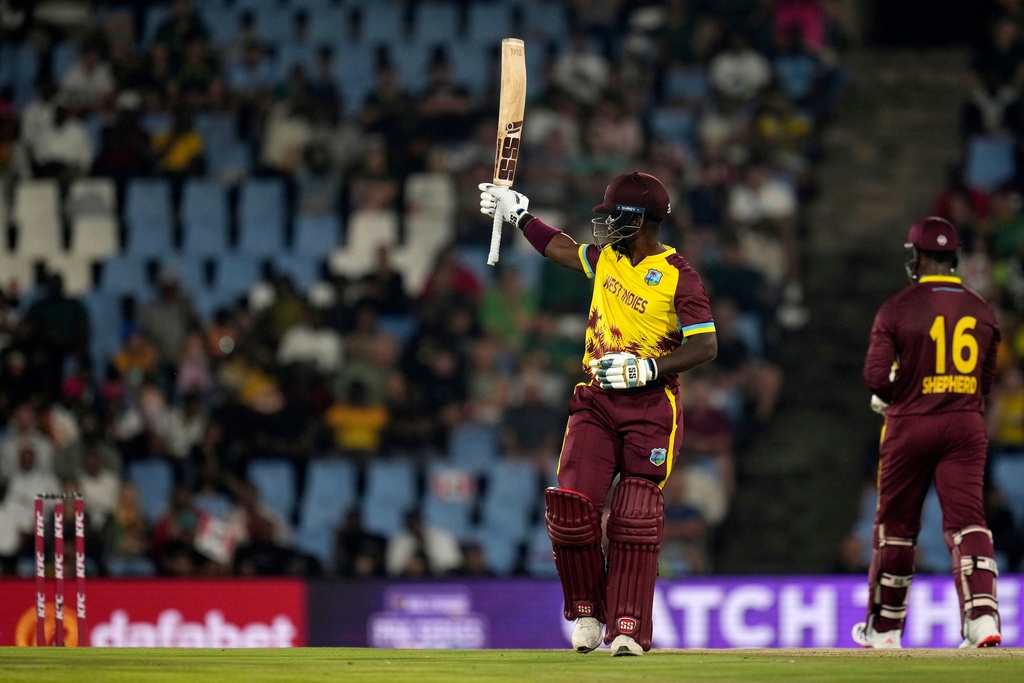 West Indies batsman Sherfane Rutherford raises his bat after reaching a half century during the T20 International cricket match between South Africa and West Indies, in Centurion, South Africa, Thursday, Jan. 29, 2026. (AP Photo/Themba Hadebe)