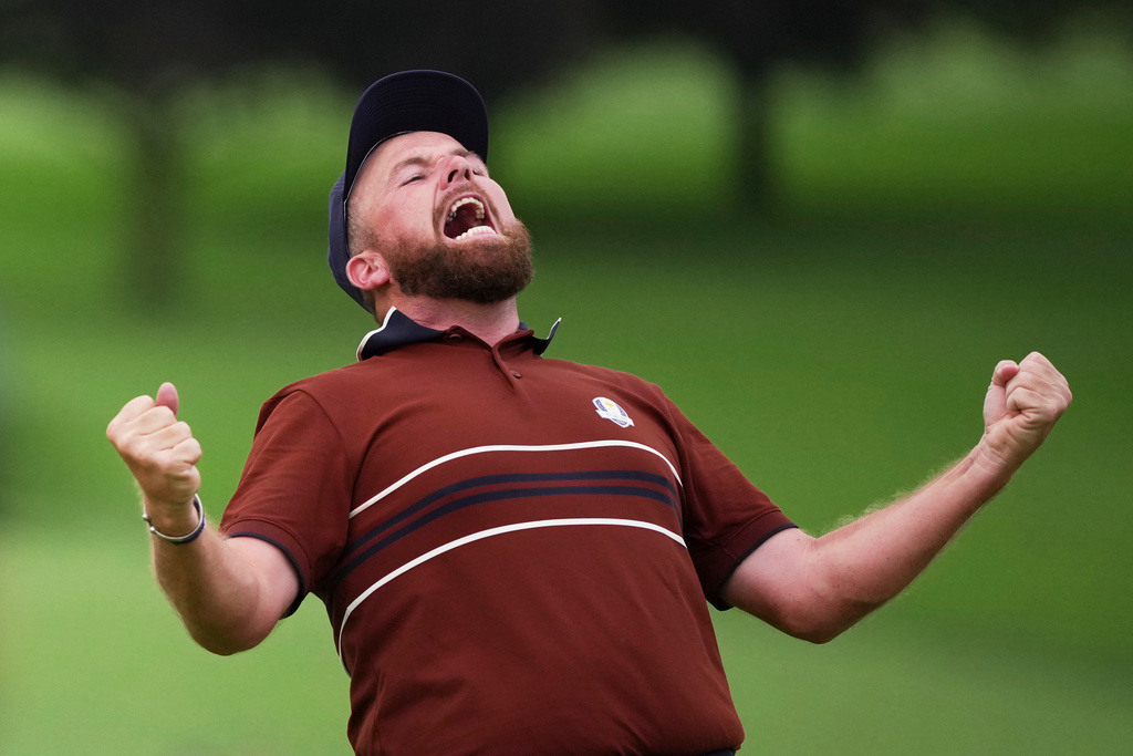 Europe's Shane Lowry react after their match win on the 18th hole at Bethpage Black golf course during the Ryder Cup golf tournament, Saturday, Sept. 27, 2025, in Farmingdale, N.Y. (AP Photo/Matt Slocum)