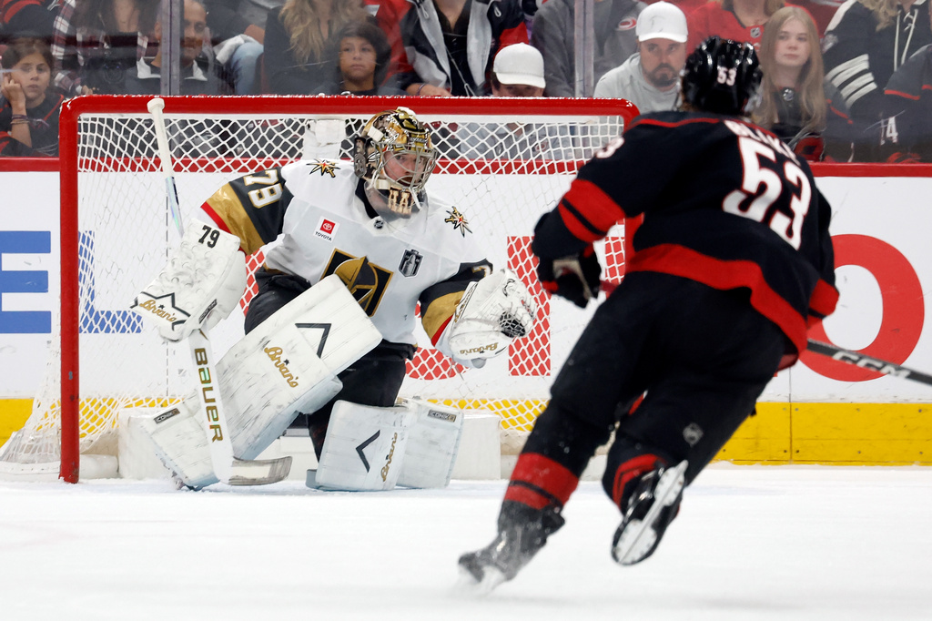 Vegas Golden Knights goaltender Carter Hart (79) snares the shot of Carolina Hurricanes' Jackson Blake (53) during the first period in Game 5 of the NHL hockey Stanley Cup Final series in Raleigh, N.C., Thursday, June 11, 2026. (AP Photo/Karl DeBlaker)