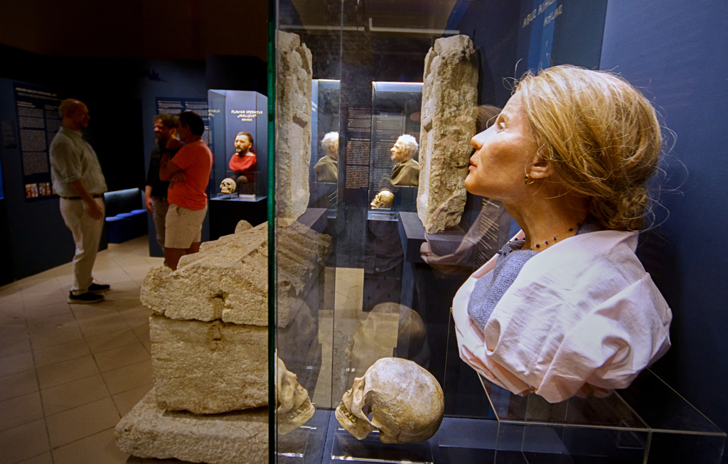 Roman-era skulls and their facial reconstructions are on display at the Aquincum Museum's exhibition titled "Once we were like you" which showcases characters and the fictional life stories of those who once lived in the bustling Roman settlement of Aquincum, in Budapest, Hungary, Tuesday, July 7, 2026. (AP Photo/Bela Szandelszky)