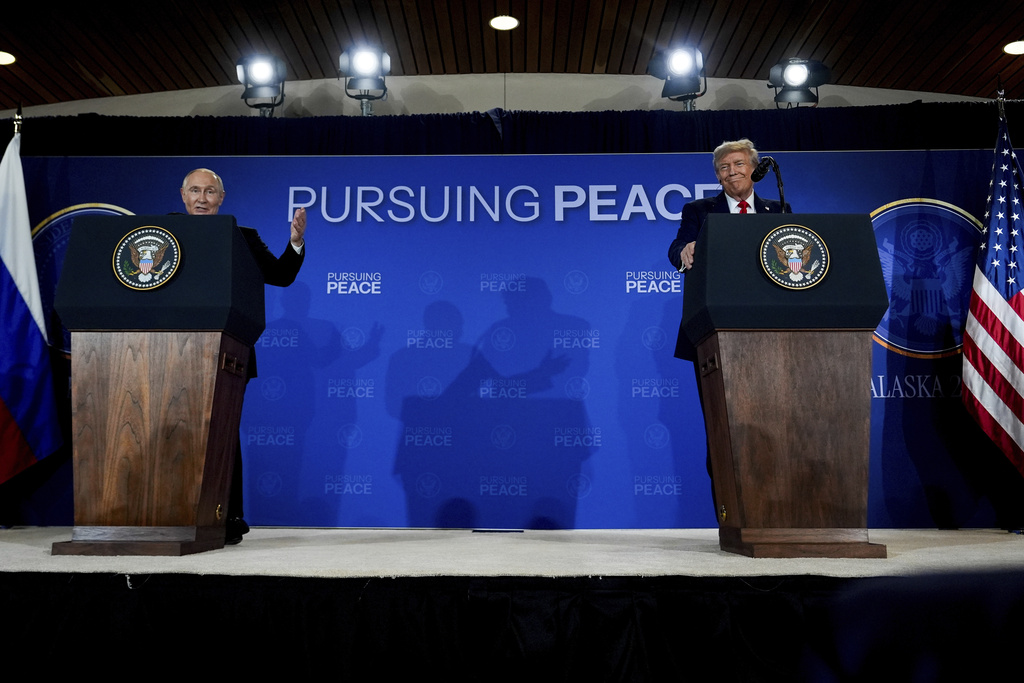 President Donald Trump listens as Russia's President Vladimir Putin speaks during a news conference at Joint Base Elmendorf- Richardson, Friday, Aug. 15, 2025, in Anchorage, Alaska. (AP Photo/Julia Demaree Nikhinson)