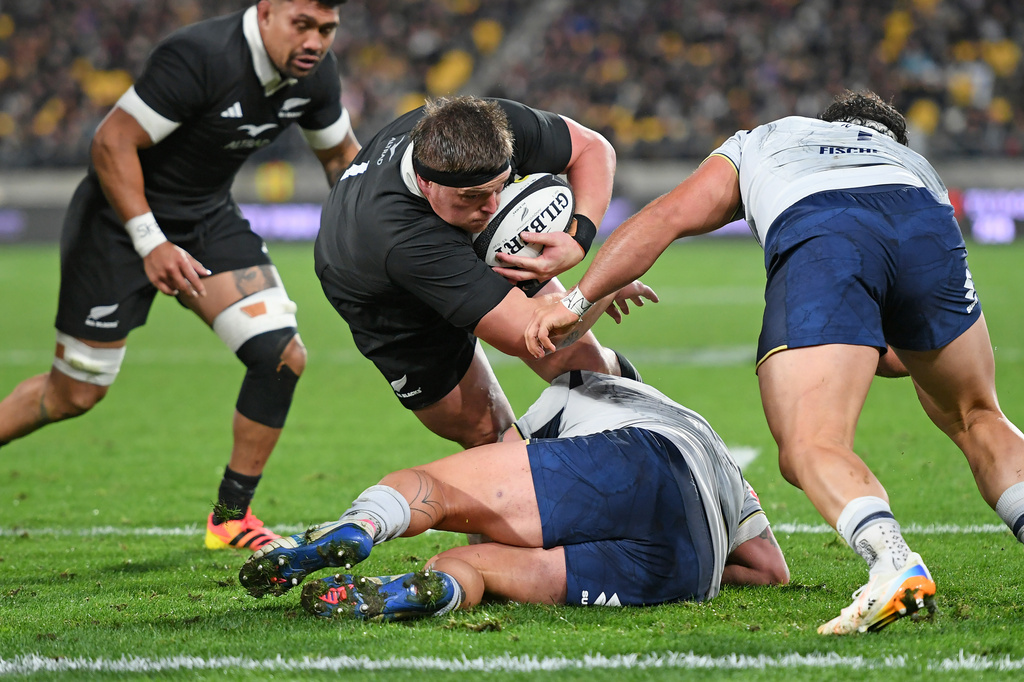 New Zealand's Ethan de Groot is tackled short of the try line during the Nations Championship rugby international between the All Blacks and Italy in Wellington, New Zealand, Saturday, July 11, 2026. (Kerry Marshall/Photosport via AP)