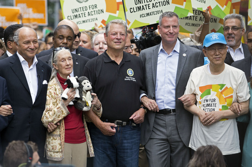 FILE - French Foreign Minister Laurent Fabius, from left, primatologist Jane Goodall, former U.S. Vice President Al Gore, New York Mayor Bill de Blasio and U.N. Secretary General Ban Ki-moon participate in the People's Climate March in New York, Sept. 21, 2014. (AP Photo/Craig Ruttle, File) FILE - French Foreign Minister Laurent Fabius, from left, primatologist Jane Goodall, former U.S. Vice President Al Gore, New York Mayor Bill de Blasio and U.N. Secretary General Ban Ki-moon participate in the People's Climate March in New York, Sept. 21, 2014. (AP Photo/Craig Ruttle, File)
