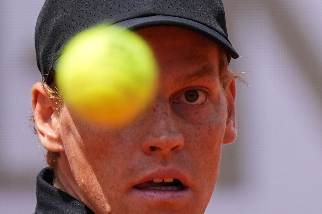Italy's Jannik Sinner eyes the ball as he plays Andrey Rublev, during their match at the Italian Open tennis tournament in Rome, Thursday, May 14, 2026. (AP Photo/Andrew Medichini)