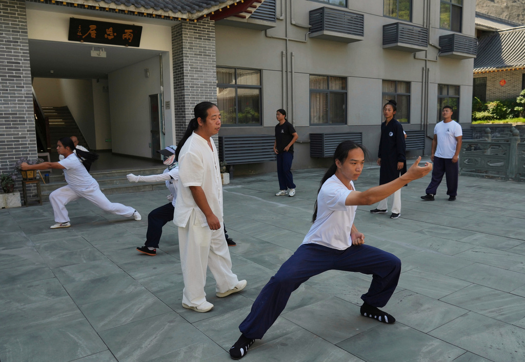 Students practice at the Wudang Taoist Traditional Kung Fu Academy near Wudang Mountain in Shiyan city in central China's Hubei province on Friday, Sept. 4, 2026. (AP Photo/Achmad Ibrahim)