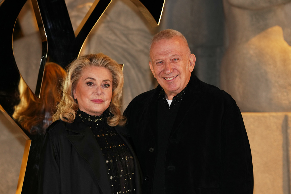 Catherine Deneuve and Jean-Paul Gaultier pose before the Saint Laurent Spring/Summer 2026 collection presented in Paris, France, Monday, Sept. 29, 2025. (AP Photo/Aurelien Morissard)