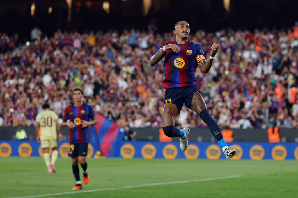 Barcelona's Raphinha celebrates after scoring his side's second goal during the Joan Gamper trophy soccer match between FC Barcelona and Al Ahly at the Camp Nou Stadium in Barcelona, Spain, Wednesday, Aug. 19, 2026. (AP Photo/Joan Monfort)