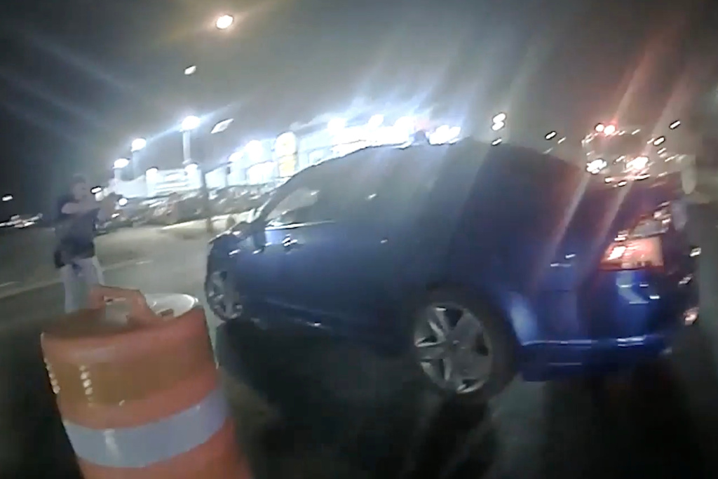 In this image from video provided by the Texas Department of Public Safety, Homeland Security Investigations Special Agent Jack Stevens points his weapon at Ruben Ray Martinez in his vehicle at a roadblock in South Padre Island, Texas, on March 15, 2025. (Officer Miguel Leal/Texas Department of Public Safety via AP)