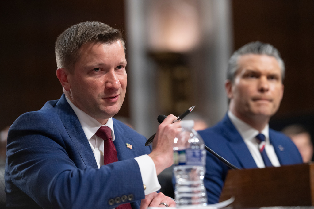 Secretary of Defense Pete Hegseth, right, looks on as Jules Hurst III, acting undersecretary of defense, testifies during a Senate Armed Services Committee hearing on the Department of Defense budget, on Capitol Hill, in Washington, Thursday, April 30, 2026. (AP Photo/Cliff Owen)
