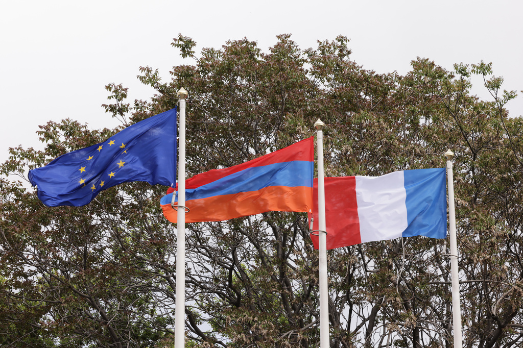 From left, the EU, Armenian and French flags flap in the wind outside the Presidential Palace during the EU-Armenia summit in Yerevan, Armenia, Tuesday, May 5, 2026. (AP Photo/Anthony Pizzoferrato)