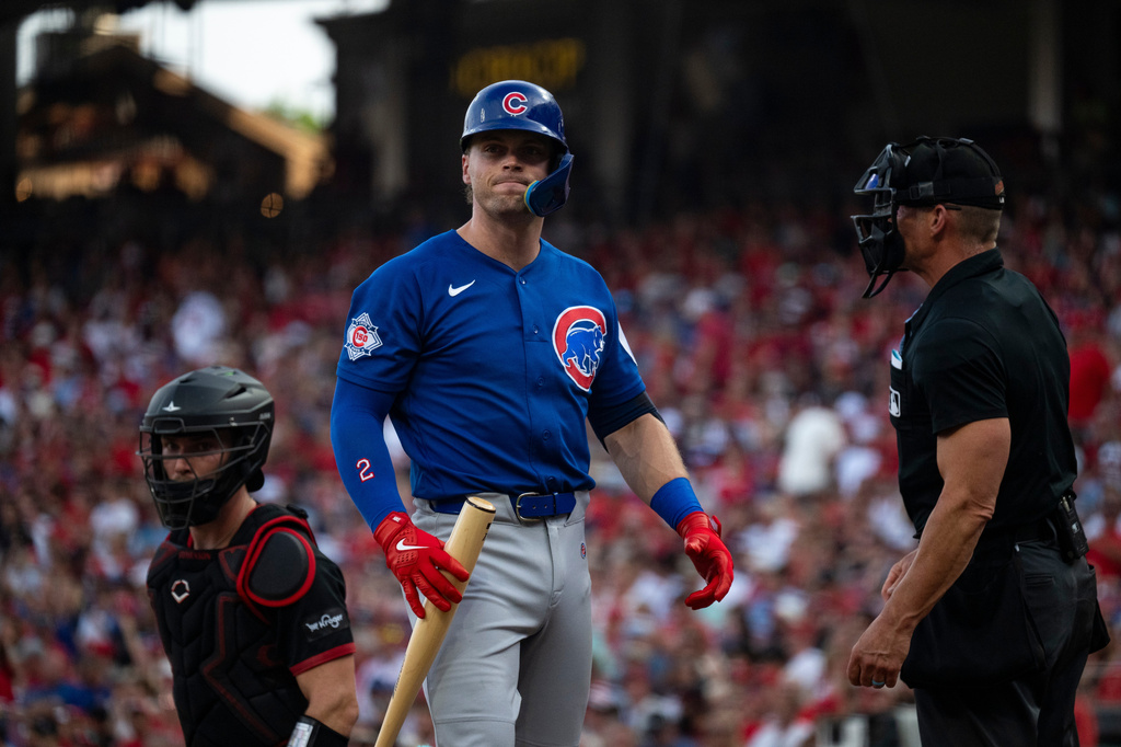 Chicago Cubs' Nico Hoerner reacts after striking out in the second inning of a baseball game against the Cincinnati Reds Friday, July 10, 2026 in Cincinnati. (AP Photo/Michael Swensen)