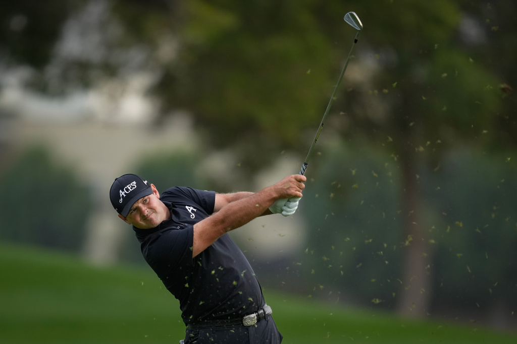 Patrick Reed of the United States plays his second shot on the 18th hole during the final round of the Dubai Desert Classic in United Arab Emirates, Sunday, Jan. 25, 2026. (AP Photo/Altaf Qadri)