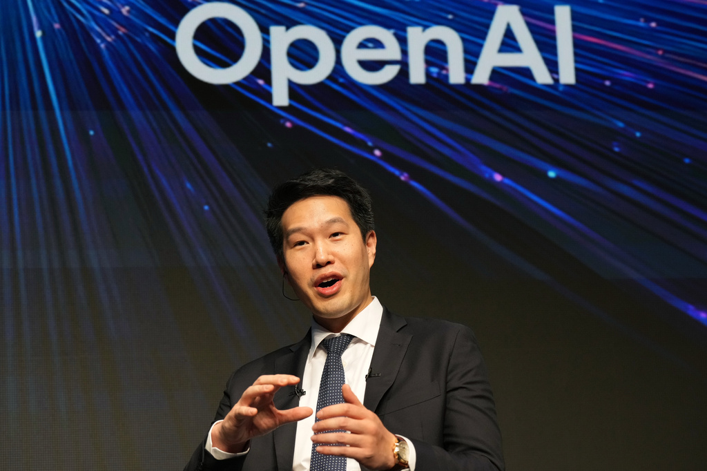 Mark Chen, chief research officer for OpenAI, speaks during a talk with Masayoshi Son, chairman and CEO of SoftBank Group, at their business event at a hotel in Tokyo, Tuesday, June 16, 2026. (AP Photo/Hiro Komae)