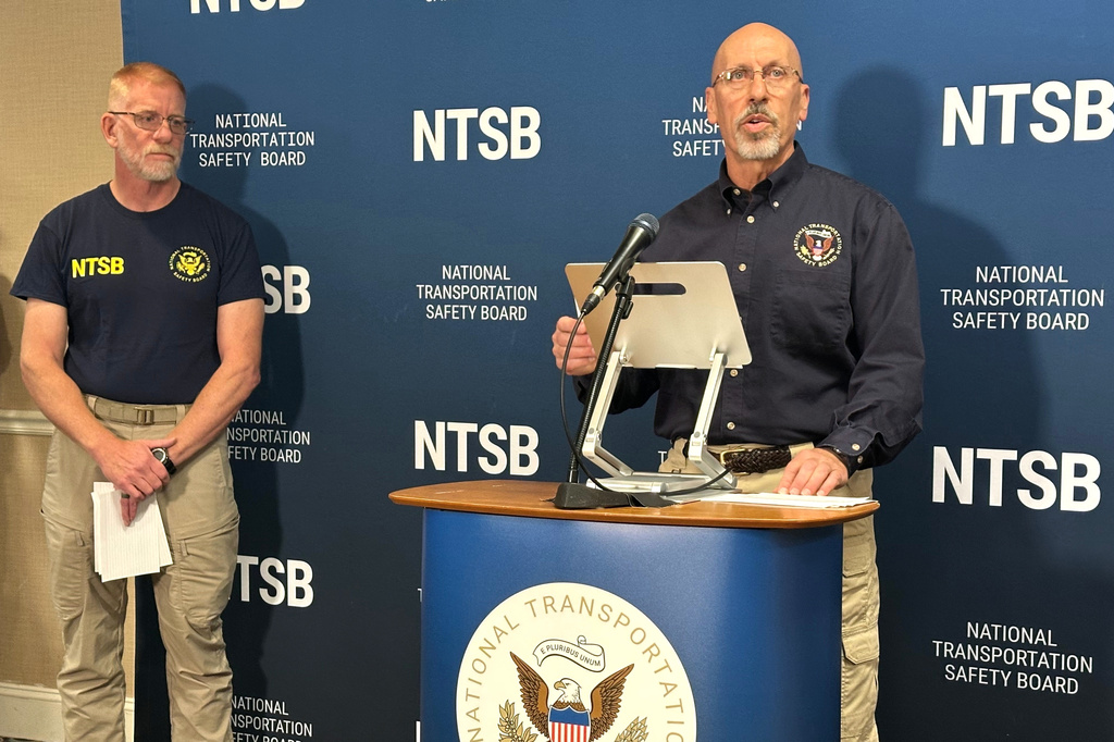 National Transportation Safety Board member Michael Graham, right, speaks at a media briefing on the fatal plane crash that killed former NASCAR driver Greg Biffle and his family, while NTSB investigator Dan Baker listens on Friday, Dec. 19, 2025, in Statesville, N.C. (AP Photo/Gary D. Robertson)