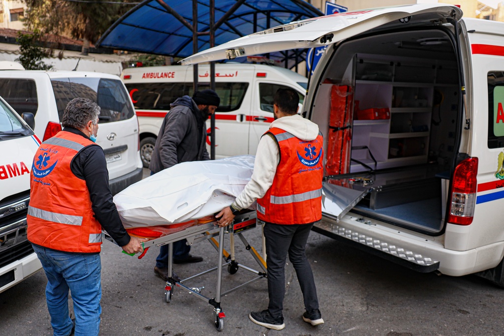 The body of one of the victims of an Israeli forces raid in the southern Syrian village of Beit Jin is brought to Al-Mowasat Hospital in Damascus, Friday, Nov. 28, 2025. (AP Photo/Omar Albam)