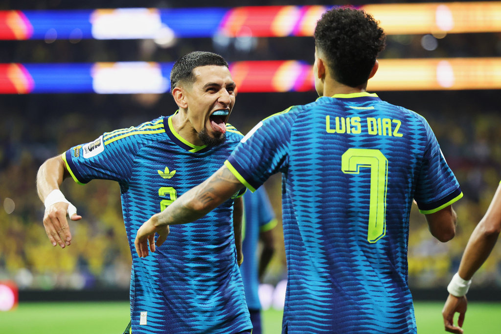 Colombia's Luis Diaz (7) celebrates with Daniel Munoz (2) after scoring their second goal during the World Cup Group K soccer match between Uzbekistan and Colombia in Mexico City, Wednesday, June 17, 2026. (AP Photo/Ashtin Barker)