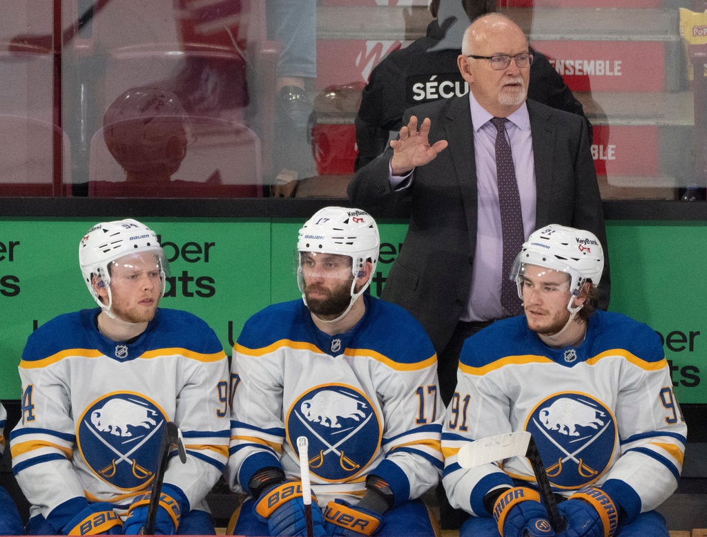 Buffalo Sabres head coach Lindy Ruff, top right, gives instructions from the bench during the third period of Game 6 in a second-round NHL hockey Stanley Cup playoff series against the Montreal Canadiens in Montreal, Saturday, May 16, 2026. (Christinne Muschi/The Canadian Press via AP)