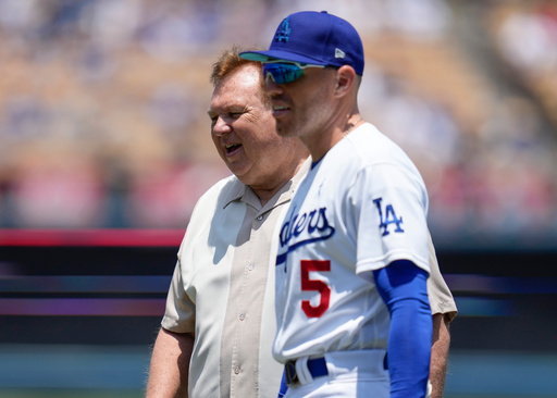 FILE - Los Angeles Dodgers first baseman Freddie Freeman (5) on the field walks with his father, Fred Freeman, before a baseball game against the San Francisco Giants in Los Angeles, Sunday, June 18, 2023. (AP Photo/Ashley Landis, File) FILE - Los Angeles Dodgers first baseman Freddie Freeman (5) on the field walks with his father, Fred Freeman, before a baseball game against the San Francisco Giants in Los Angeles, Sunday, June 18, 2023. (AP Photo/Ashley Landis, File)