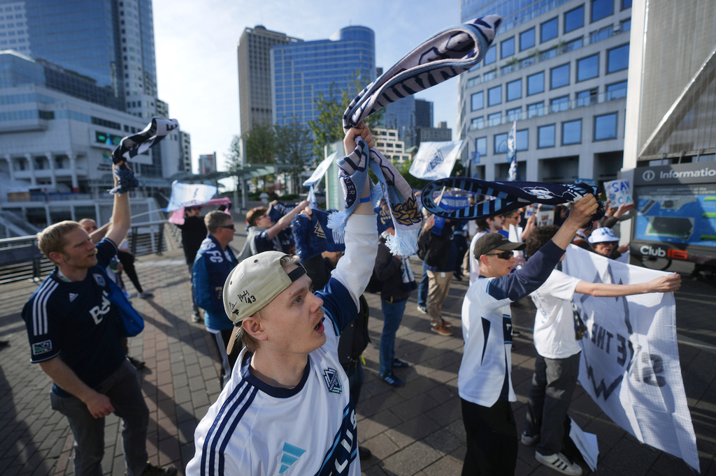 Fans of the Vancouver Whitecaps MLS soccer team rally to keep the team in Vancouver, Thursday, April 30, 2026, outside the 76th FIFA Congress in Vancouver, British Columbia. (Darryl Dyck/The Canadian Press via AP)