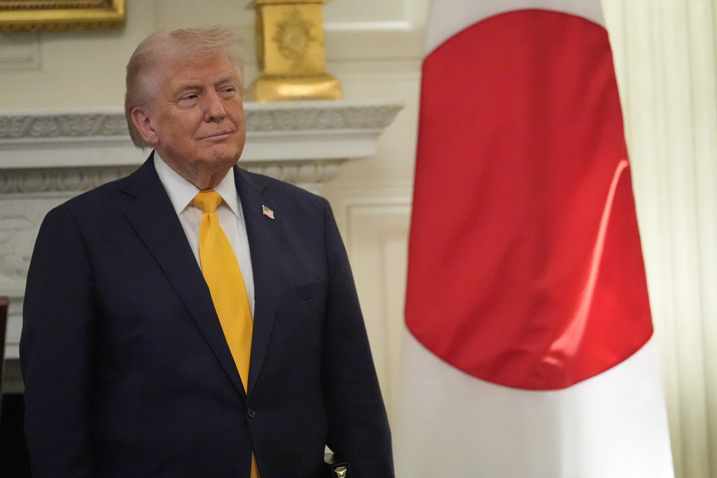 President Donald Trump listens as Japan's Prime Minister Sanae Takaichi speaks during a dinner in the State Dining Room of the White House, Thursday, March 19, 2026, in Washington. (AP Photo/Julia Demaree Nikhinson)
