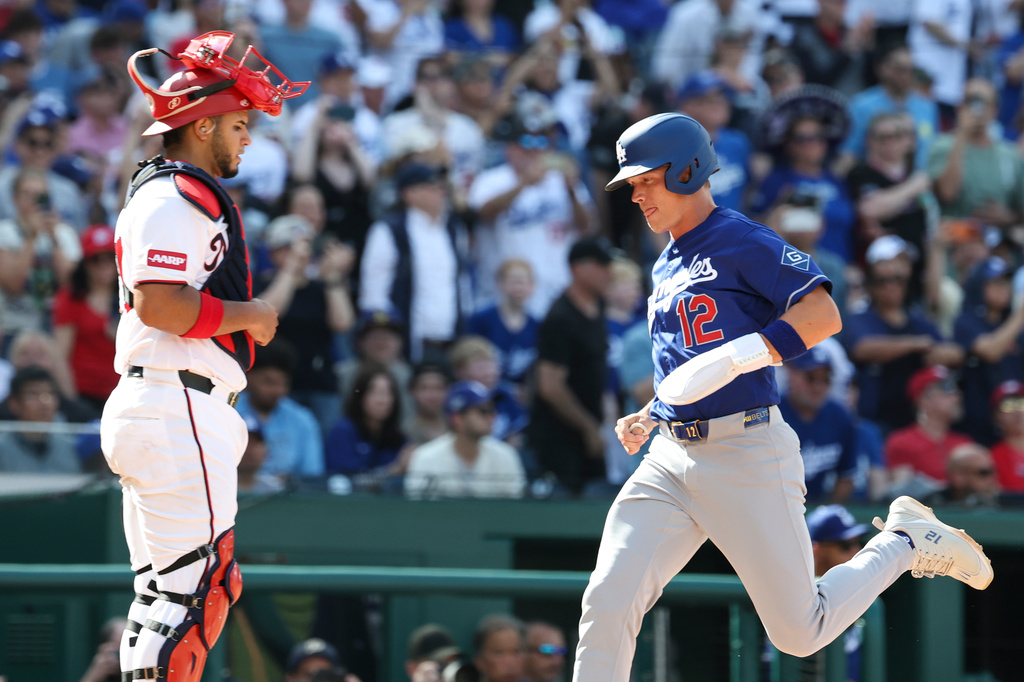 Los Angeles Dodgers' Alex Call (12) scores a run on a sacrifice fly hit by Shohei Ohtani off Washington Nationals pitcher Andre Granillo (not shown) during the ninth inning of a baseball game, Friday, April 3, 2026, in Washington. (AP Photo/Terrance Williams)