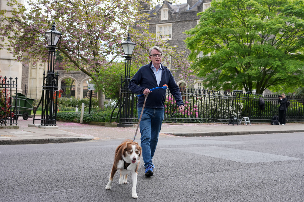 Peter Mandelson is seen with his dog outside his home in London, Monday, April 20, 2026 as Britain's Prime Minister Keir Starmer is facing a showdown in Parliament over the appointment of Peter Mandelson as ambassador to Washington.(AP Photo/Kin Cheung)