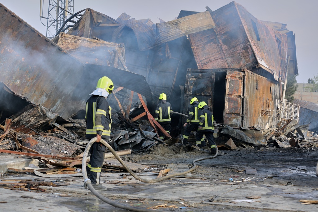 Firefighters work at the site of a late-Monday airstrike at a drug rehabilitation hospital in Kabul, Afghanistan, Tuesday, March 17, 2026. (AP Photo/Siddiqullah Alizai)