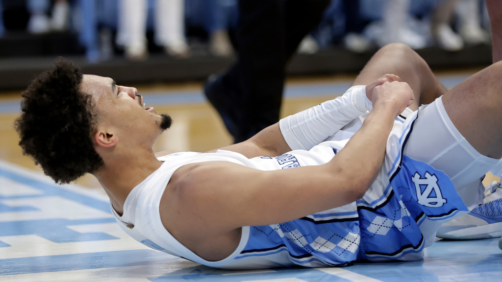 North Carolina guard Seth Trimble (7) celebrates after making a basket and picking up foul during the first half of an NCAA college basketball game against Louisville, Monday, Feb. 23, 2026, in Chapel Hill, N.C. (AP Photo/Chris Seward)