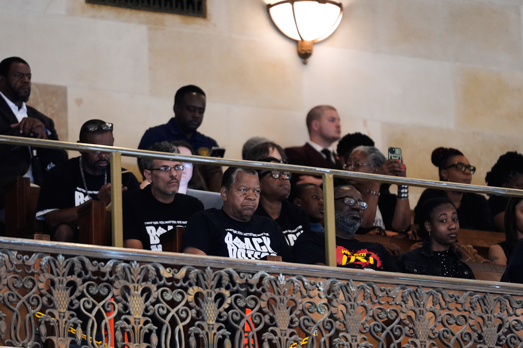 Members of the public who oppose a redistricting plan to eliminate a majority-Black congressional district in response to a U.S. Supreme Court ruling, listen to House members prior to a vote on it, in Baton Rouge, La., Thursday, May 21, 2026. (AP Photo/Gerald Herbert)