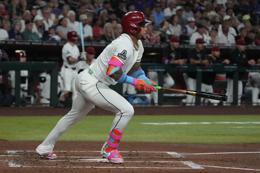 Arizona Diamondbacks' Ketel Marte watches his two-run double against the Minnesota Twins in the second inning of a baseball game, Sunday, June 21, 2026, in Phoenix. (AP Photo/Rick Scuteri)