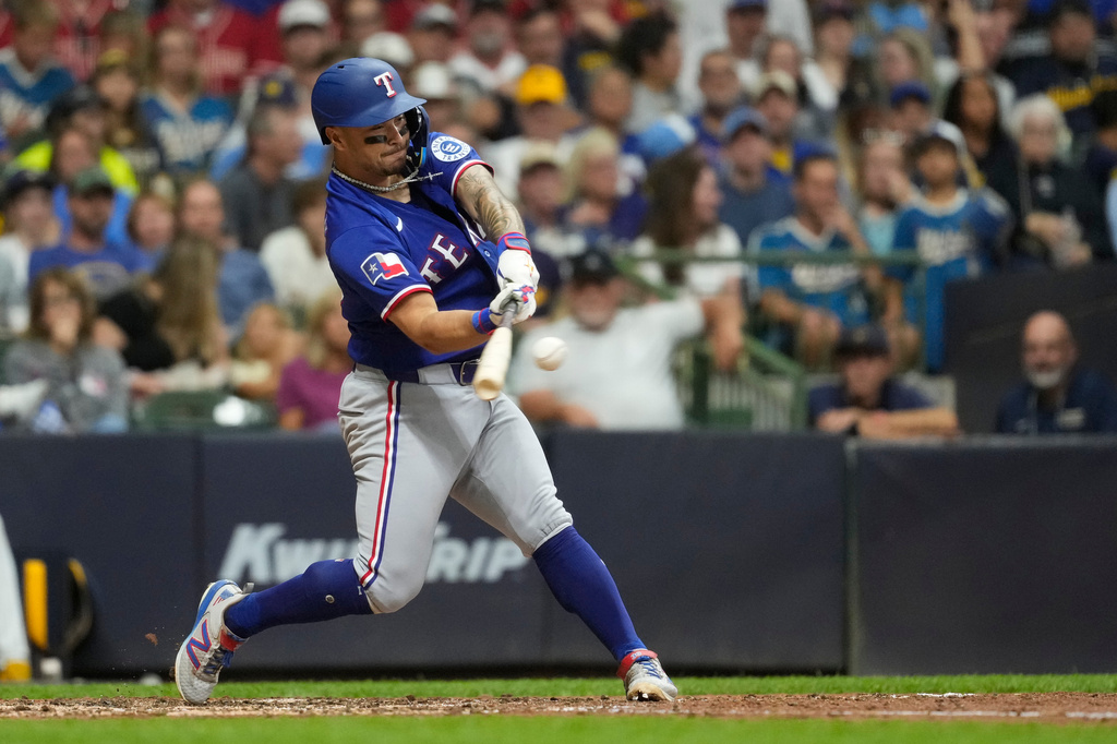 Texas Rangers' Cody Freeman hits a solo home run during the fifth inning of a baseball game against the Milwaukee Brewers, Saturday, Aug. 29, 2026, in Milwaukee. (AP Photo/Aaron Gash)