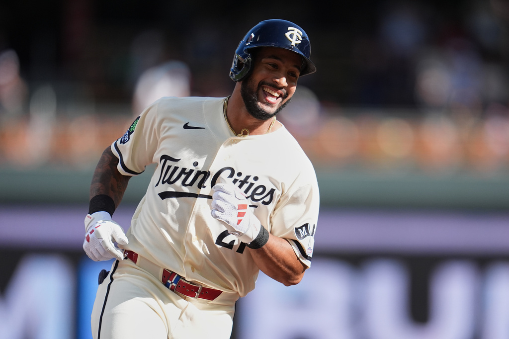 Minnesota Twins' Emmanuel Rodriguez (21) runs the bases after hitting a solo home run for his first-career hit during his MLB debut in the third inning of a baseball game in Minneapolis, Saturday, Sept. 12, 2026. (AP Photo/Abbie Parr)