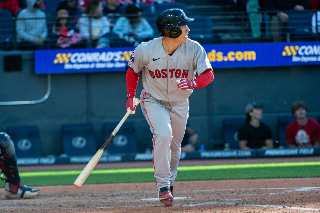 Boston Red Sox' Masataka Yoshida watches his fly out off Clveland Guardians relief pitcher Codi Heuer during the seventh inning of a baseball game, Saturday, May 30, 2026, in Cleveland. (AP Photo/Phil Long)