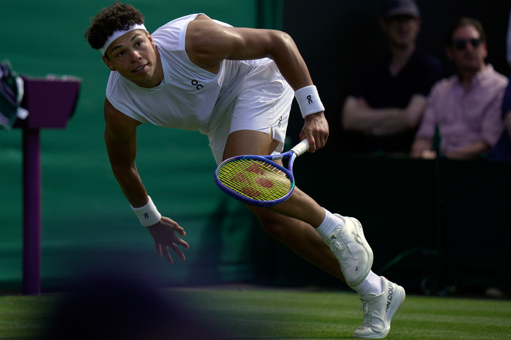 Ben Shelton of the United States runs for the ball as he plays against Otto Virtanen of Finland during their men's singles match at the Wimbledon Tennis Championships in London, Tuesday, June 30, 2026.(AP Photo/Brian Inganga)