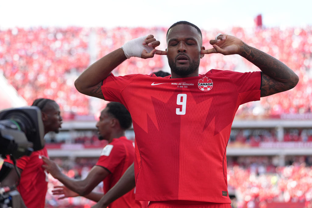 Canada's Cyle Larin (9) celebrates after scoring his sides first goal of the game in the second half of the World Cup Group B soccer match between Canada and Bosnia, Friday, June 12, 2026, in Toronto. ( (AP Photo/Sam Balkansky)
