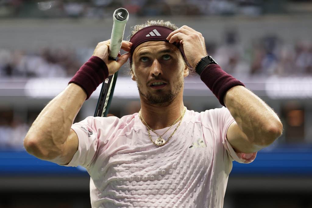 Alexander Zverev, of Germany, adjusts his headband as he competes against Ben Shelton, of the United States, during the men's singles final of the U.S. Open tennis championships Sunday, Sept. 13, 2026, in New York. (AP Photo/Adam Hunger)