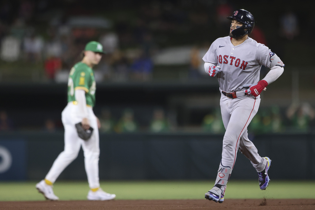 Boston Red Sox's Carlos Narváez, right, jogs around the bases after hitting a solo home run during the fifth inning of a baseball game against the Athletics, Monday, Sept. 8, 2025, in West Sacramento, Calif. (AP Photo/Scott Marshall)