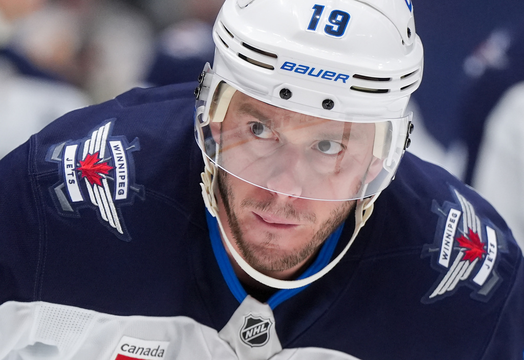Winnipeg Jets' Jonathan Toews (19) waits to take a faceoff during the third period of an NHL hockey game against the Vancouver Canucks, in Vancouver, on Tuesday, Nov. 11, 2025. (Darryl Dyck/The Canadian Press via AP)