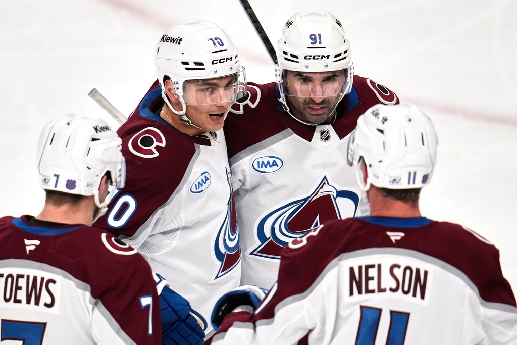 Colorado Avalanche's Sam Malinski (70) celebrates after scoring during the first period of an NHL hockey game against the Pittsburgh Penguins in Pittsburgh, Tuesday, March 24, 2026. (AP Photo/Gene J. Puskar)
